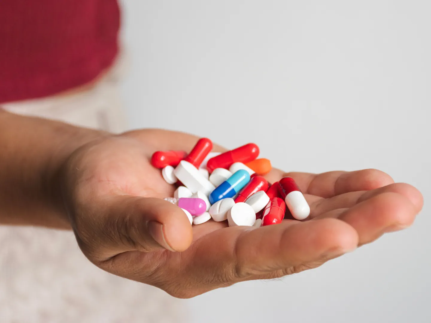 Hand Full Of Prescription Pills And Capsules